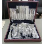 An unused canteen of Harrods stainless steel cutlery and flatware