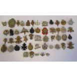 Approx. fifty military cap badges, some copies: to include RAF Police Auxiliaries; Royal Horse