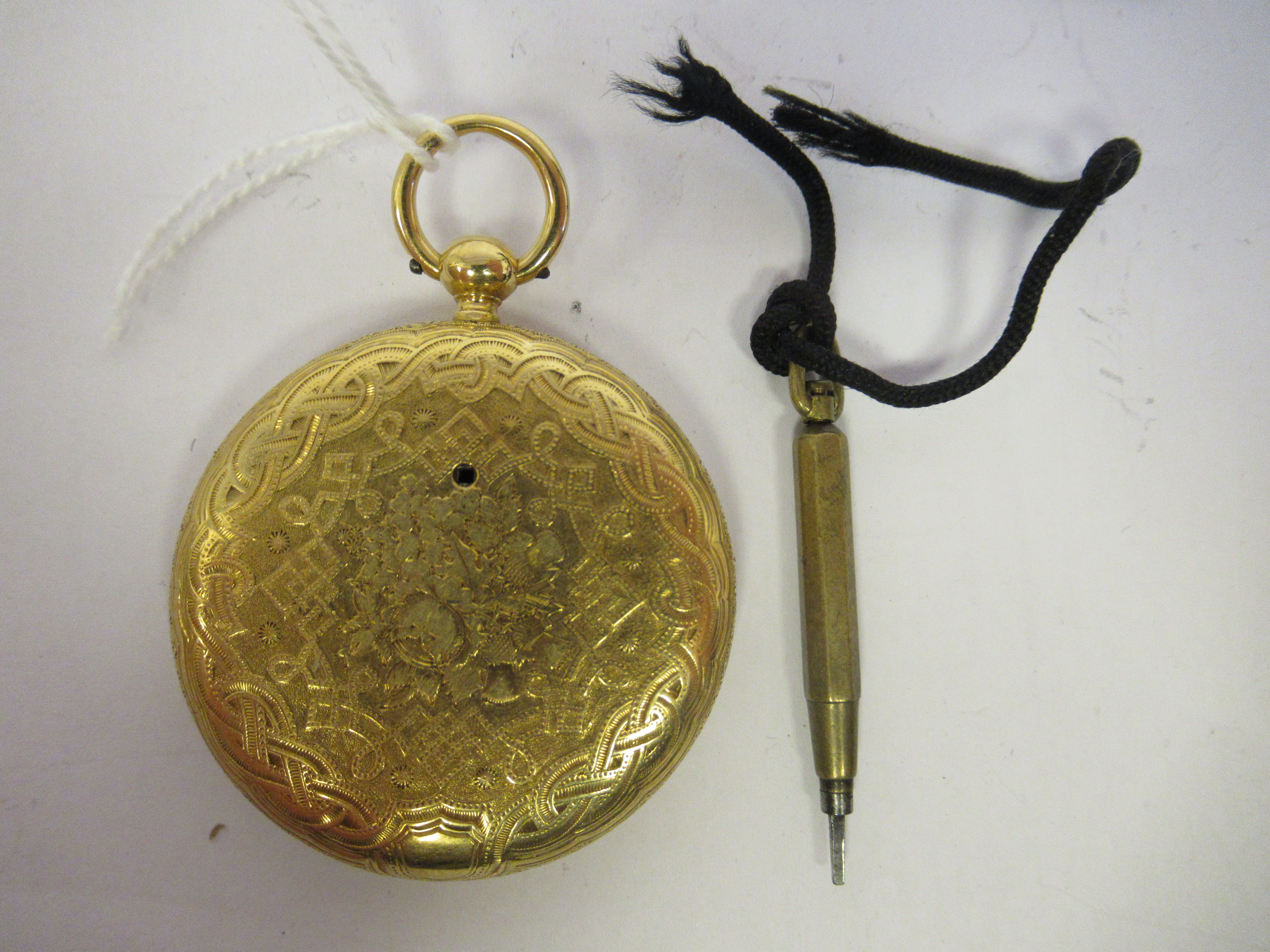 A lady's 18ct gold cased pocket watch with engraved decoration, faced by a finely engine turned - Image 2 of 3