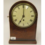 A late 19th/early 20thC round arched and boxwood string inlaid mahogany cased mantel timepiece