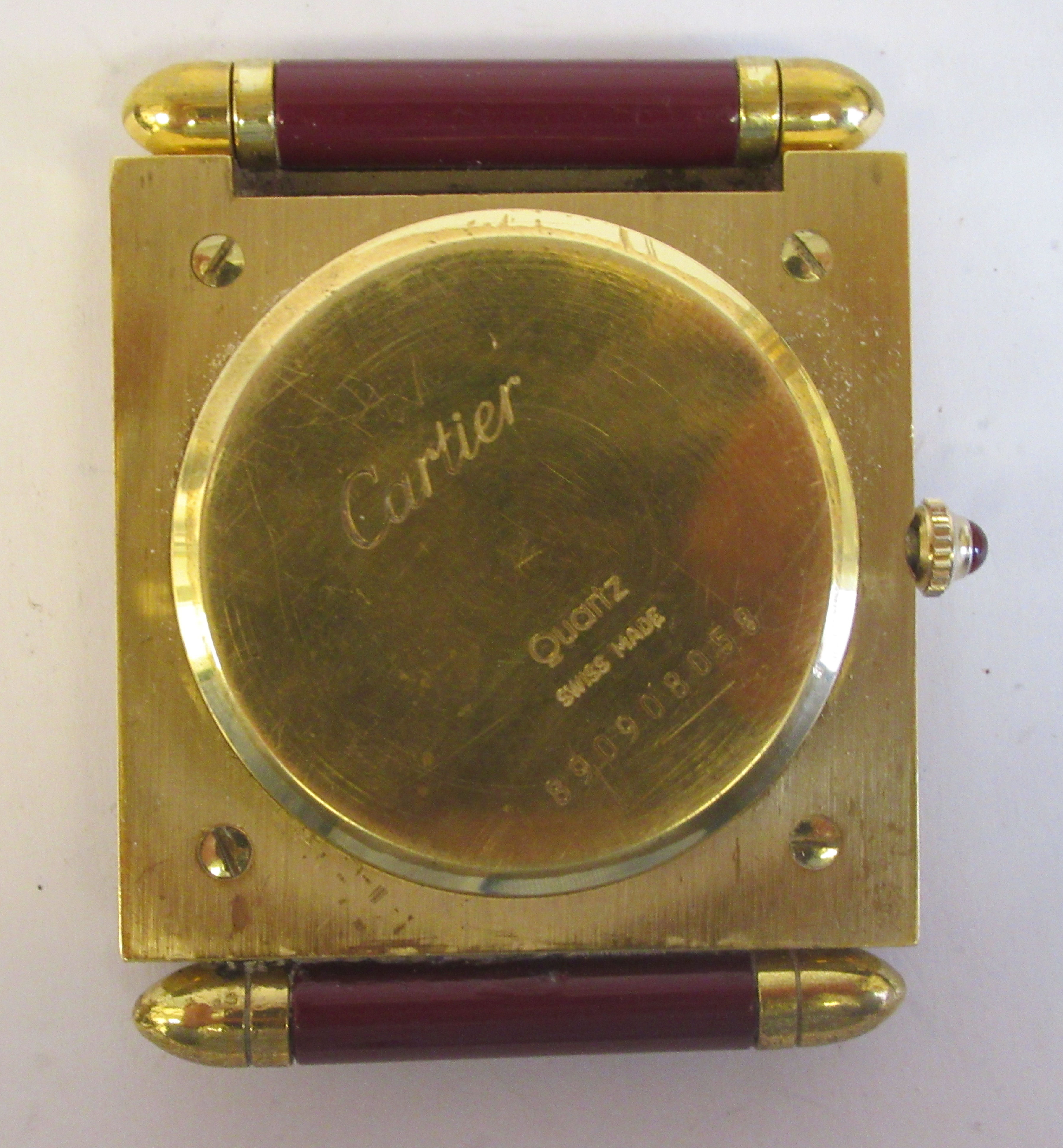 A Cartier Swiss made traveller's lacquered gilt metal cased timepiece of slim, square form with a - Image 5 of 6