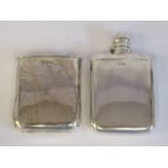 An Edwardian cushion shaped silver hip flask with a hinged, rotating mushroom design cap and