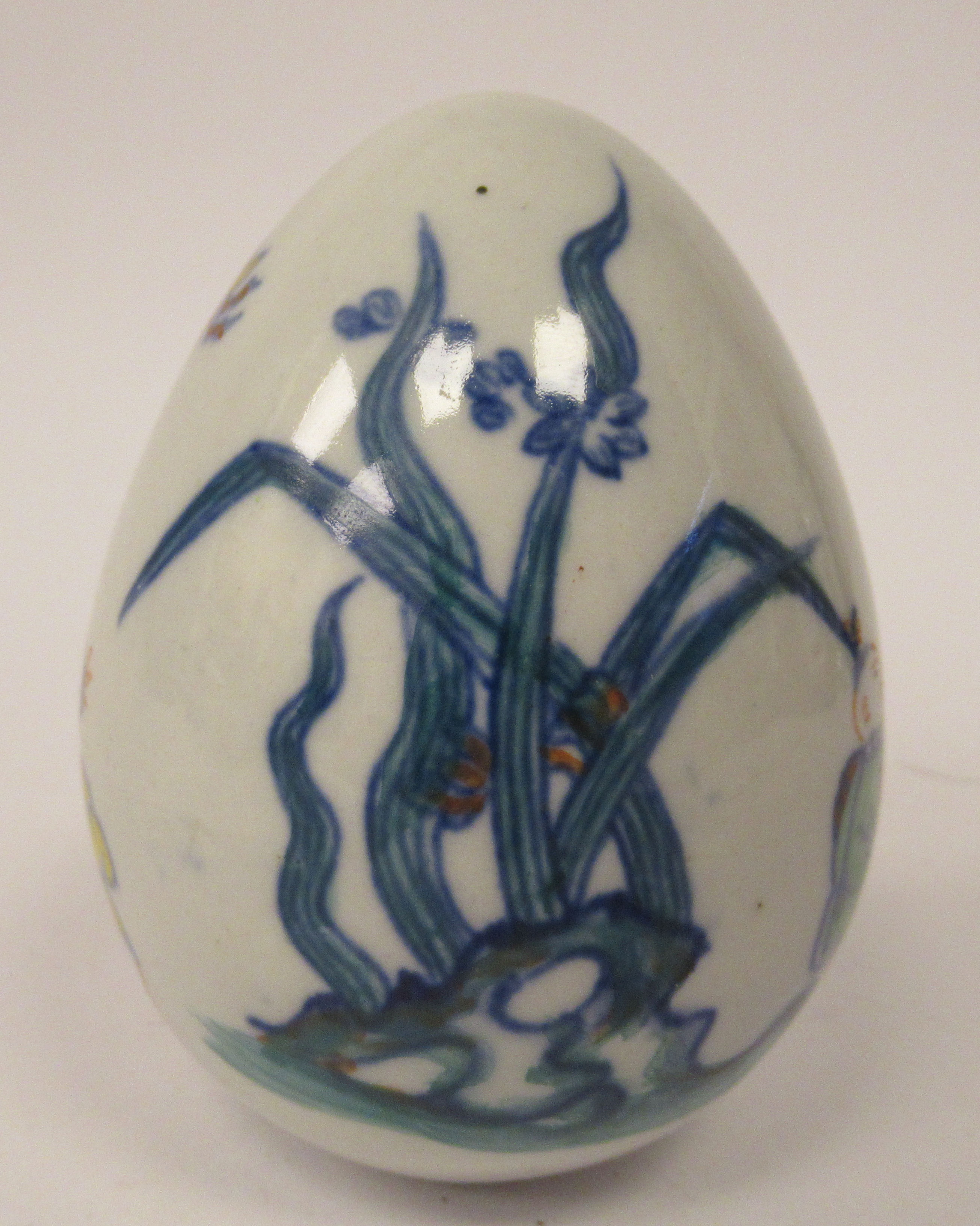 A 20thC Chinese porcelain egg shaped ornament, decorated in Doucai palette with boys at play  4''h