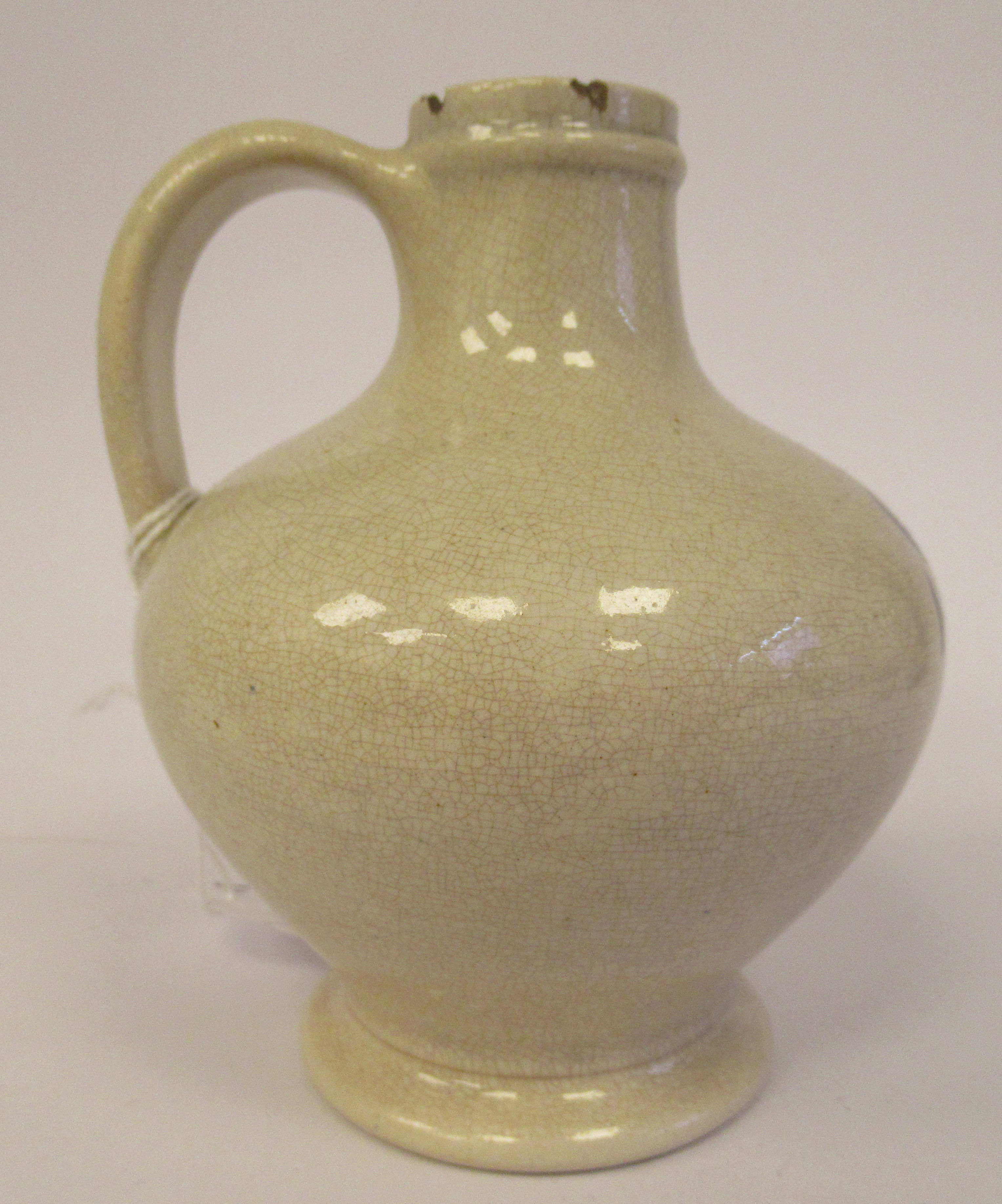 An early 19thC cream coloured Pearlware wine bottle of squat, bulbous form with a narrow neck and - Image 2 of 6