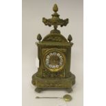 A 20thC copy of a French, decoratively cast brass mantel clock with an urn and pineapple finial,