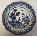 A mid 18thC Chinese porcelain wavy edged dish, decorated in blue and white with exotic birds, in a