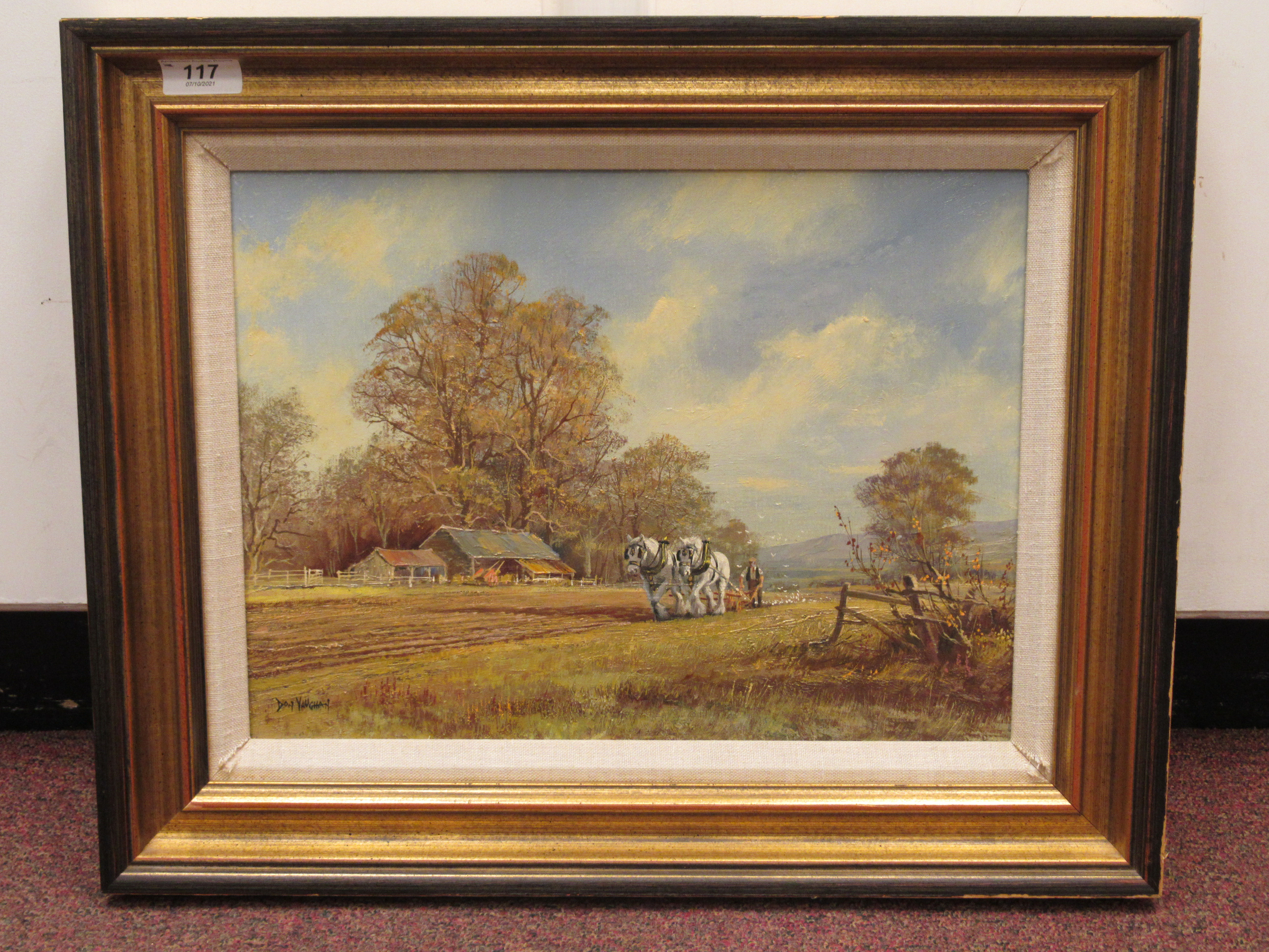 Don Vaughen - a horsedrawn plough in a landscape with farm buildings  oil on canvas  bears a