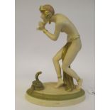 An early 20thC Royal Dux, Art Deco inspired, painted and gilded biscuit glazed porcelain female