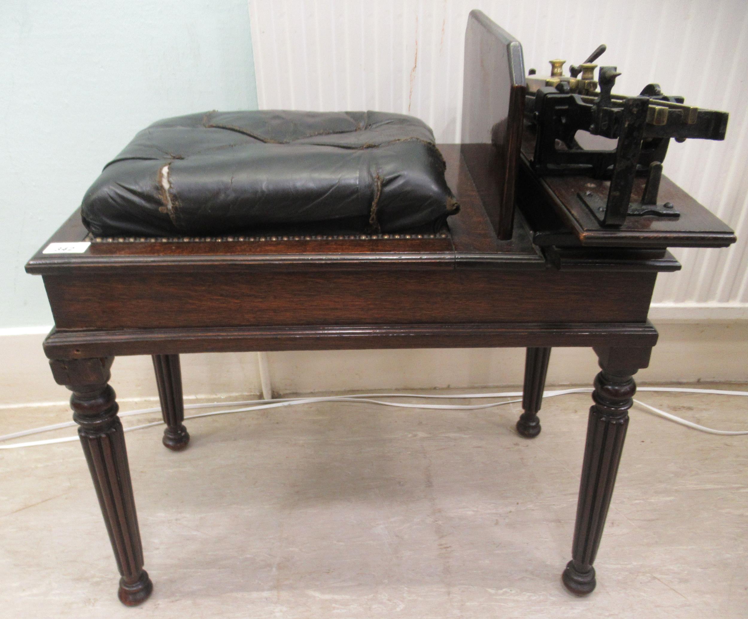 Early 20thC Avery jockey scales, the oak box top stool with a buttoned hide and stud upholstered