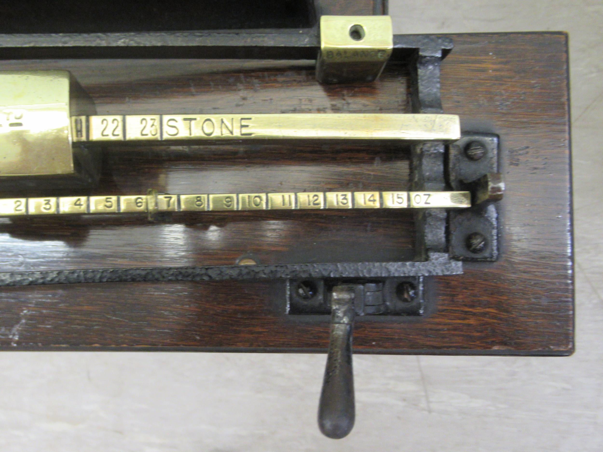 Early 20thC Avery jockey scales, the oak box top stool with a buttoned hide and stud upholstered - Image 8 of 9