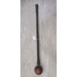 A 20thC African Zulu knobkerrie throwing club, the shaft wrapped with three wire mesh ringlets  30"L