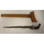 A late 19thC Malay kris, having a carved, exotic hardwood bird's head handle, the traditionally