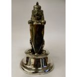 An early 20thC silver plated novelty inkwell and pen holder, fashioned as a crowned heraldic lion