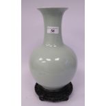 A late 19th/early 20thC Chinese porcelain celadon monochrome glazed bottle vase with a narrow neck