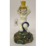 A mid 19thC English majolica spill holder, fashioned as a kneeling cherub  8''h