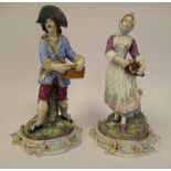 A pair of late 18thC Meissen porcelain figures, viz. a girl wearing a floral pinafore dress, playing