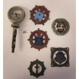Five early 20thC Continental European coloured enamel motoring related badges; and a car mascot