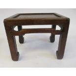 A late 19th/early 20thC Chinese Hongmu wood miniature stand with a mitred rectangular top,