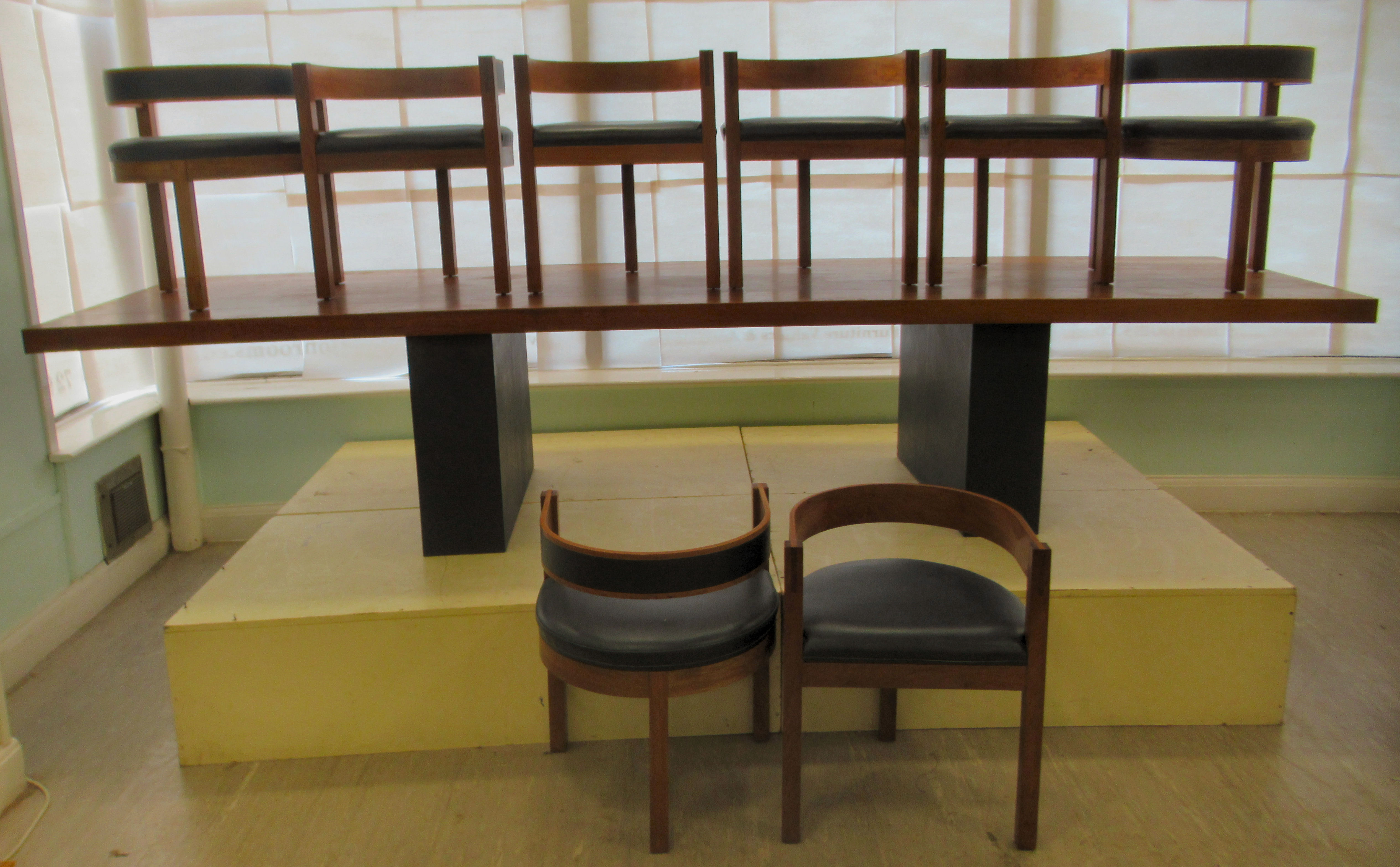 A 1960s John Makepeace OBE dining furniture, featuring a table constructed with a massive 2.5"