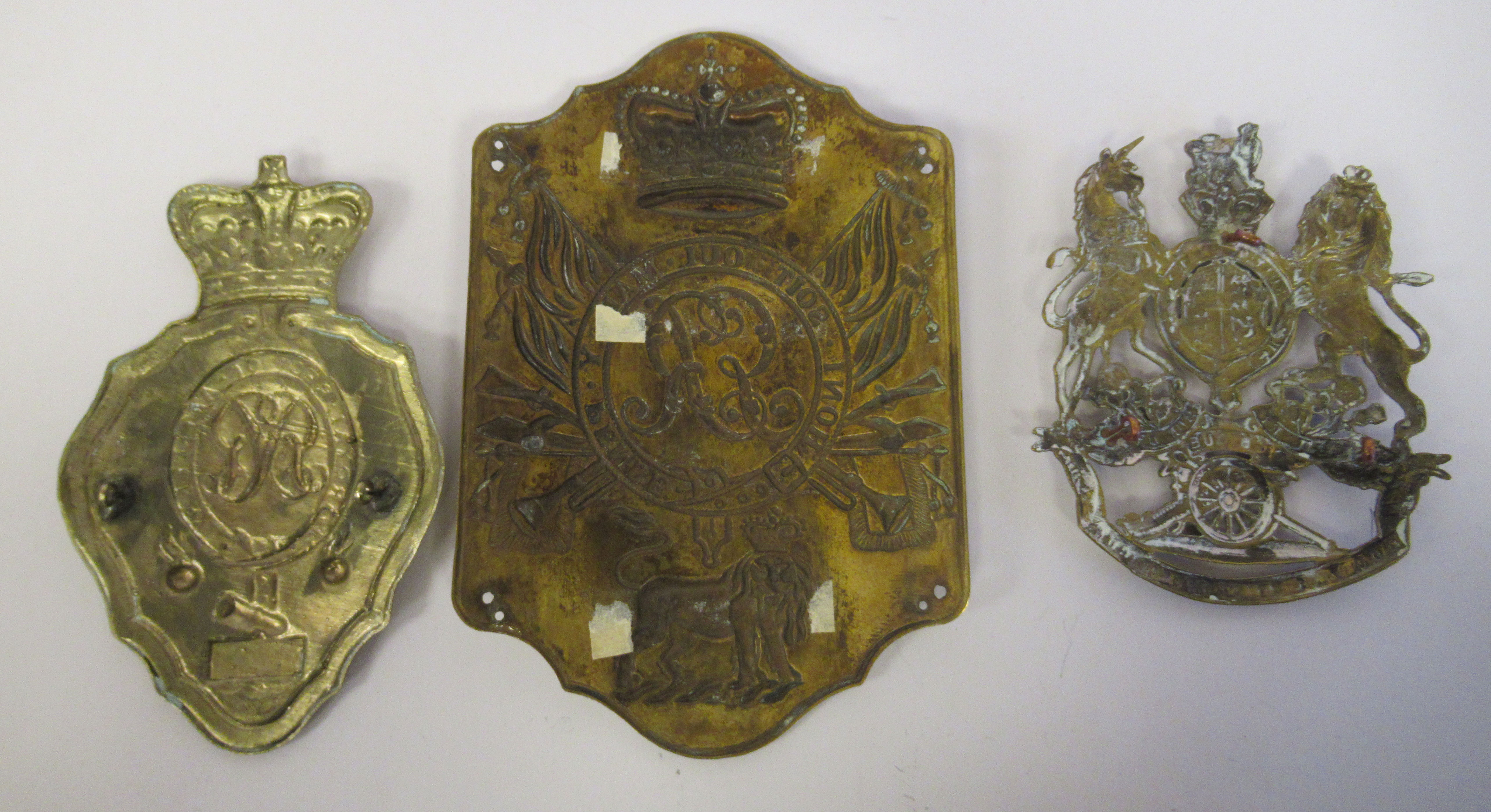 A Royal Artillery shako plate; a stove pipe shako plate; and a coat of arms helmet plate  (Please - Image 2 of 2