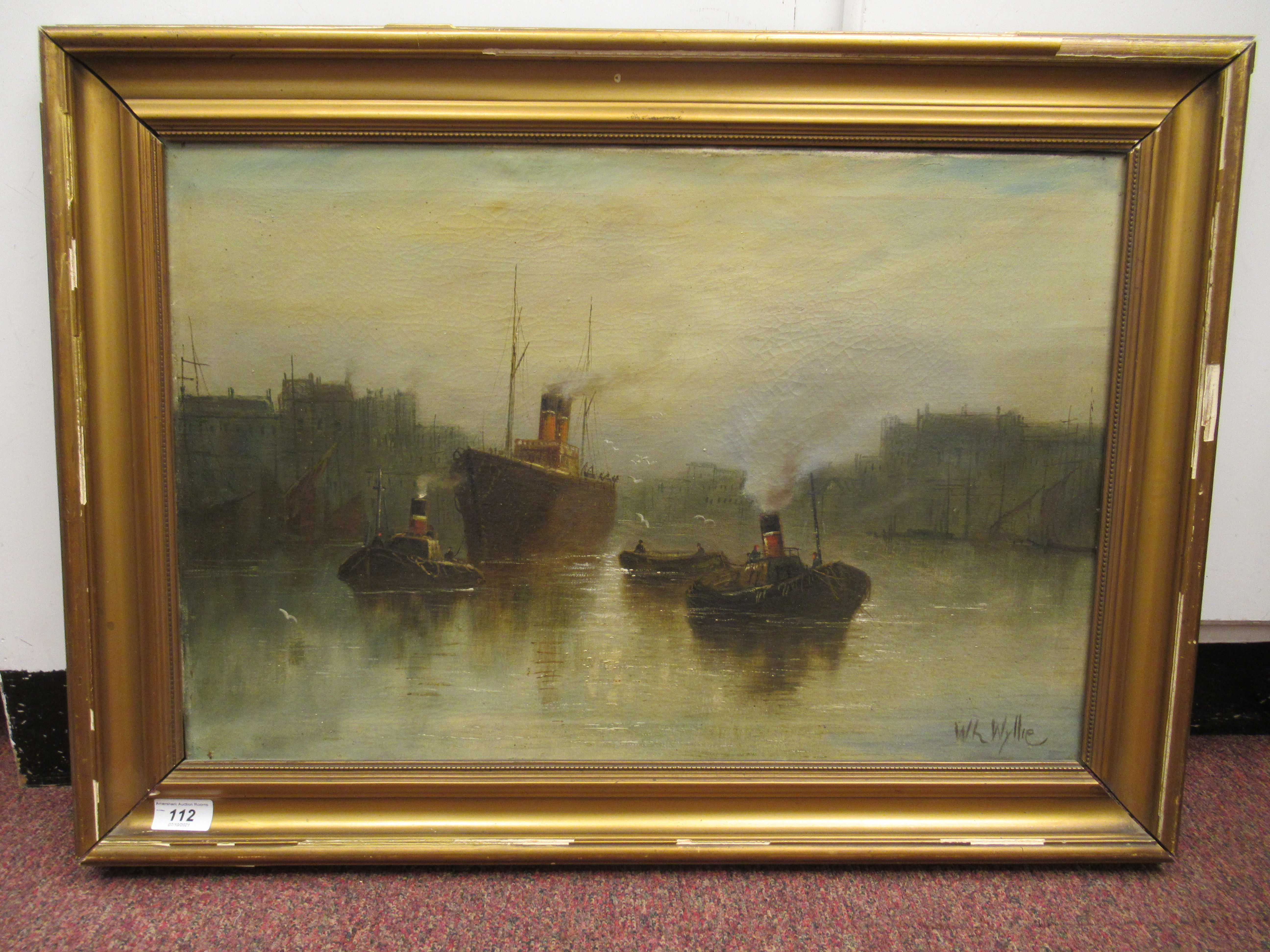 W L Wyllie - a commercial river scene with a steam ship, two tugboats and other vessels  oil on