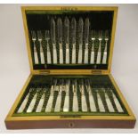 A set of twelve late Victorian silver fruit knives and forks, on mother-of-pearl handles  James