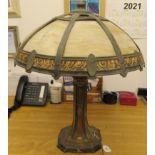 An early 20thC Miller decoratively painted cast metal table lamp of tapered form with three bulb