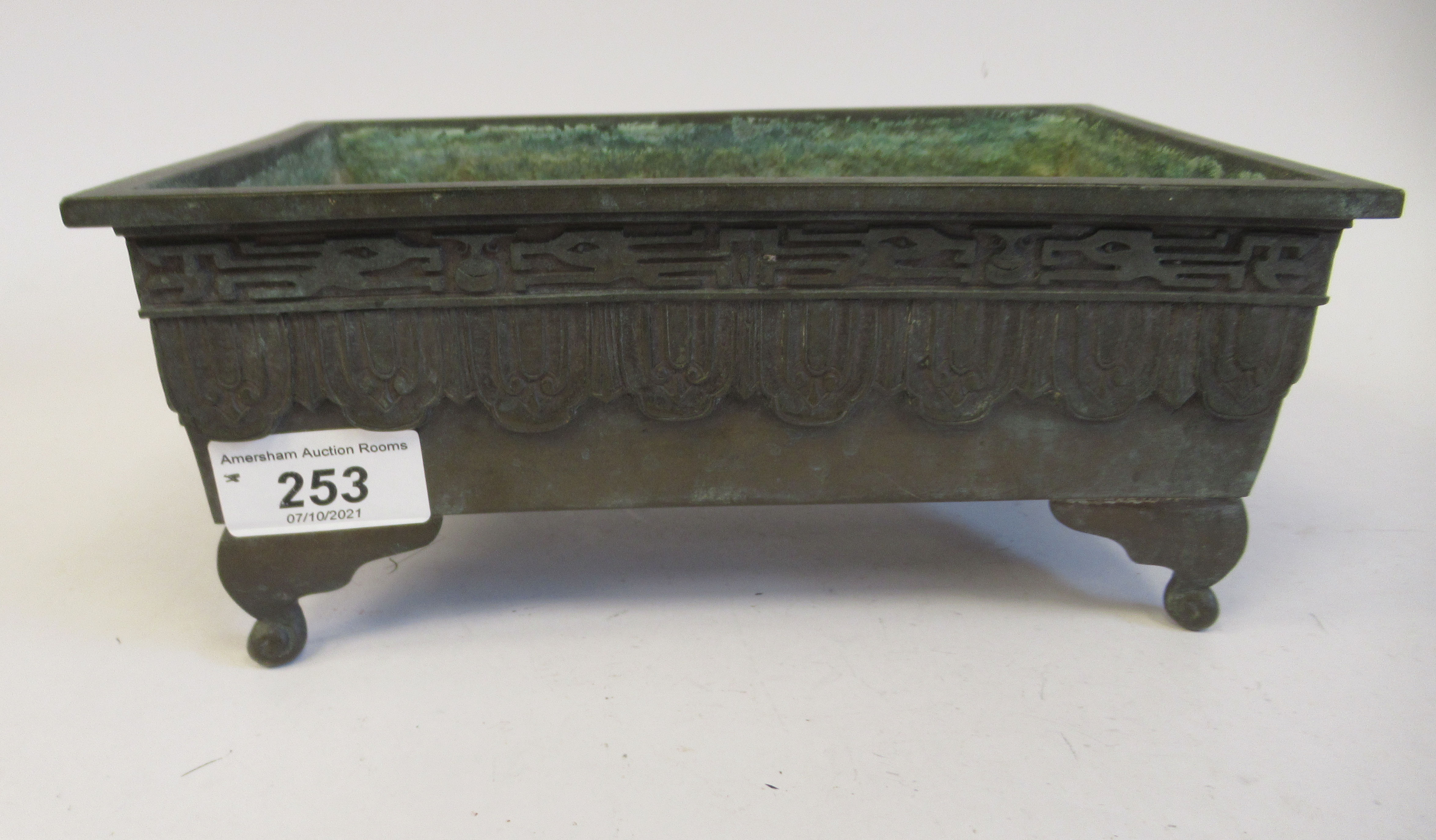 A 19thC Chinese cast and patinated bronze censer of rectangular form with opposing elephants' head