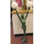 In the manner of Max Le Verrier, an Art Deco inspired patinated green bronze table lamp, the dancing