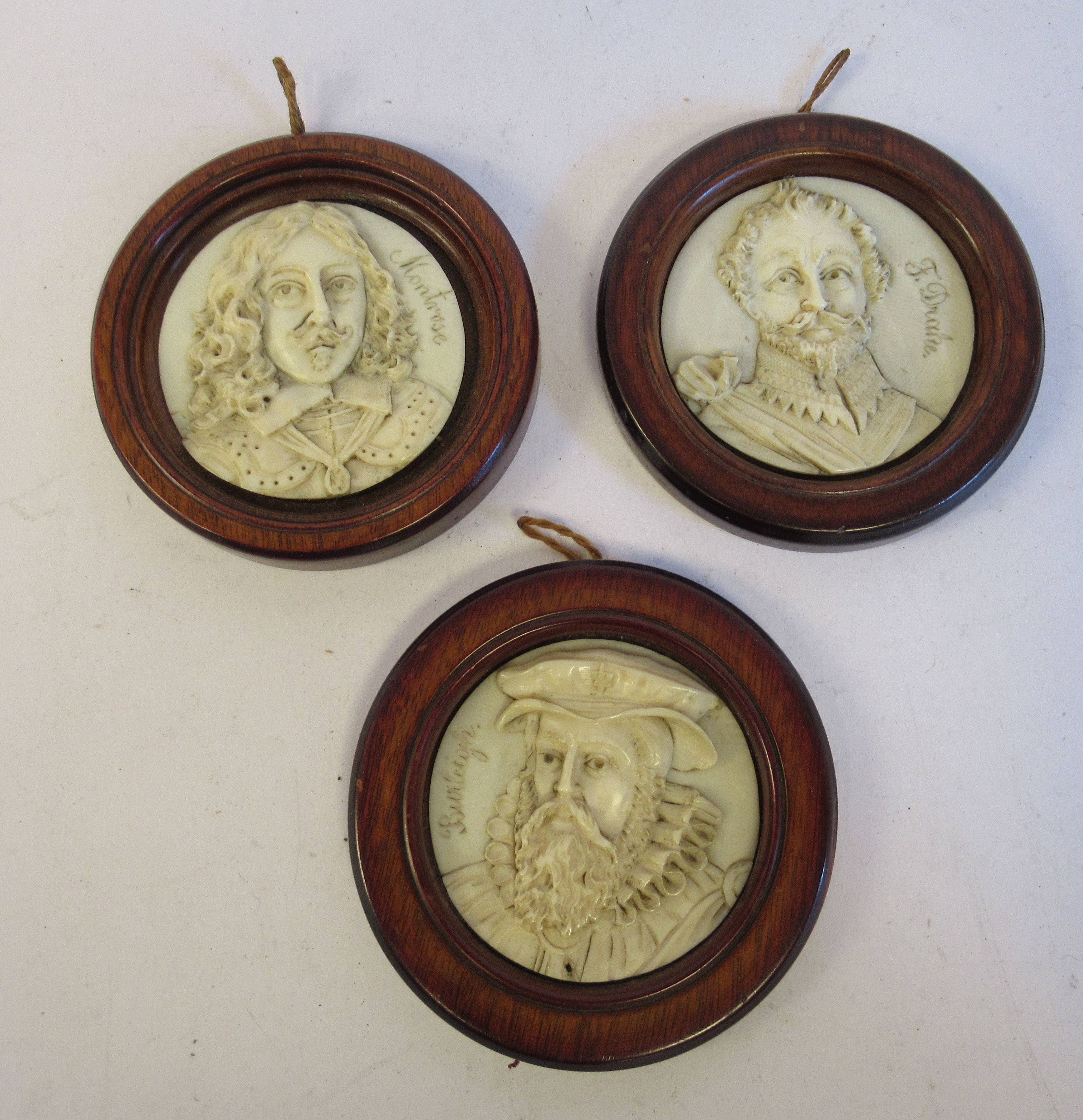 A set of three 19thC relief carved Dieppe ivory miniature head and shoulders, full face portrait