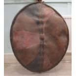 A 20thCAfrican Maasai shield painted with geometric patterns  39" x 27"