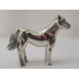 A miniature silver model, a standing horse