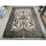 A Lahore rug, decorated with Tree of Life inspired designs, on a multi-coloured ground  67" x 92"