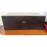 A mid 19thC rosewood writing box with straight sides and an angled hinged lid, enclosing a fitted