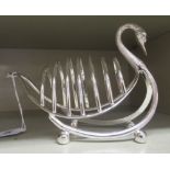 A silver plated wire framed, six division toastrack, fashioned as a swan, on bun feet