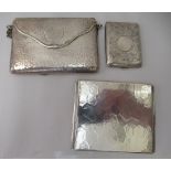 A German silver coloured metal folding cigarette case  stamped 835; a silver folding bookmark case