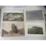 An uncollated collection of early 20thC mainly monochrome photographic postcards, featuring