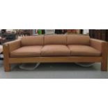 A 1960s Dancer & Hearne Conran teak framed, low back daybed/settee of planked construction with a