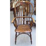 A 19thC Windsor beech and elm framed high hoop, spindled and splat back arm chair, the solid seat