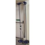 Two identical Arteluce floorstanding uplighters with midnight blue shades and bases  78"h