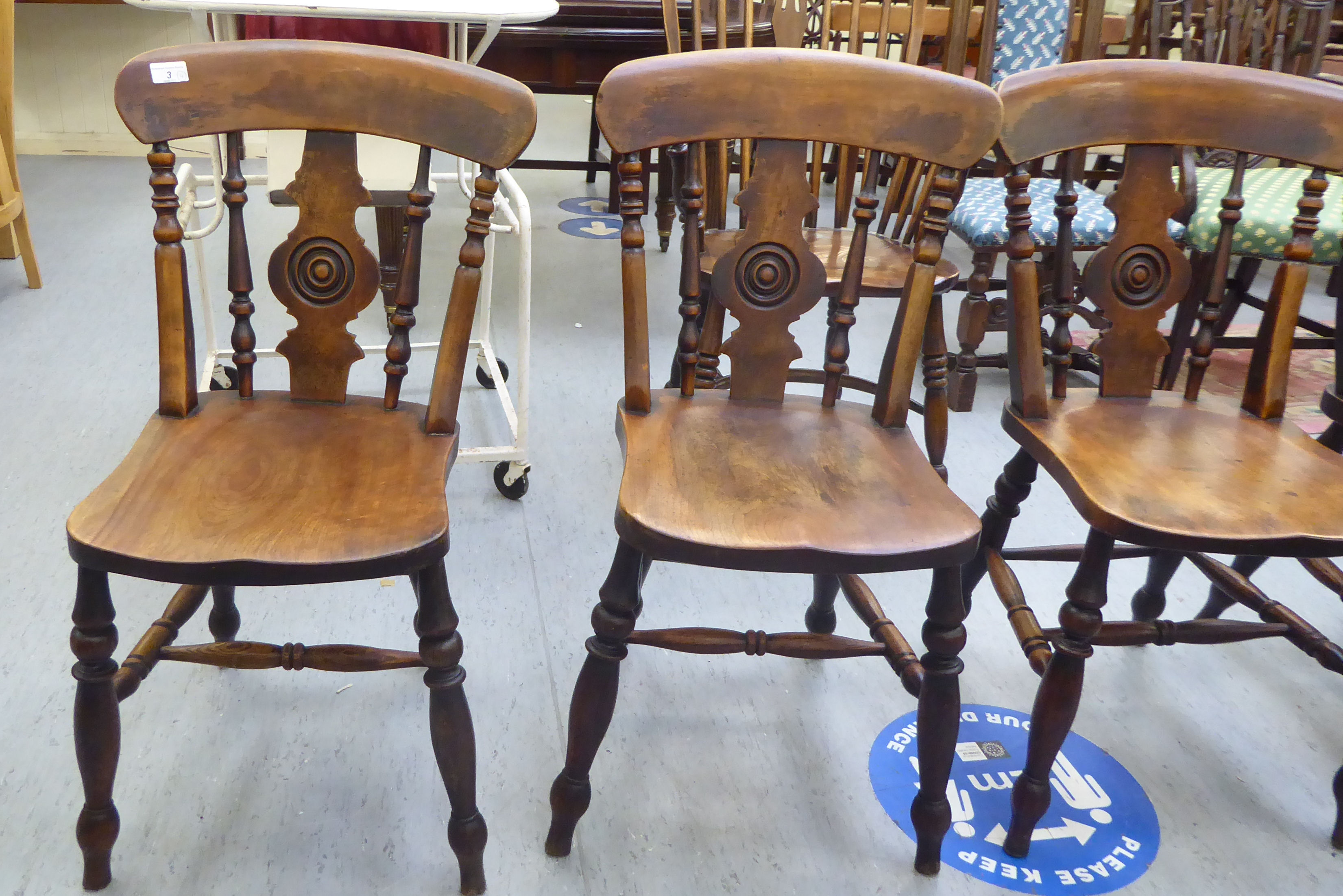 A set of four late Victorian beech and elm framed Windsor chairs, each with a spindled and roundel - Image 3 of 4