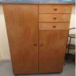 A gentleman's Schreiber Furniture teak compactum with an arrangement of two doors and three drawers,