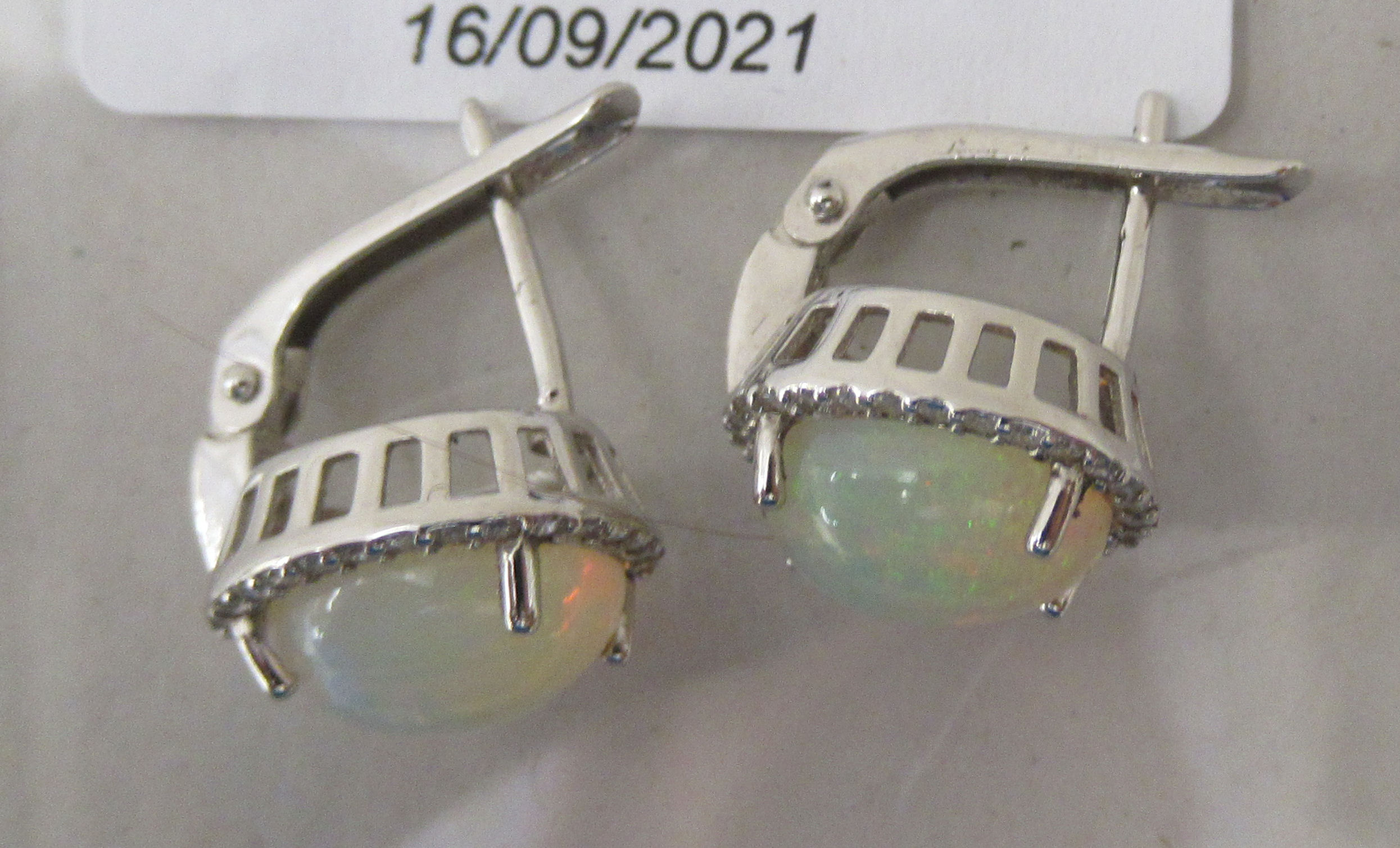A pair of claw set, opal, cubic zirconia and silver earrings - Image 2 of 2