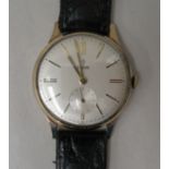 A Tudor 9ct gold cased wristwatch, the movement with sweeping seconds, faced by a baton dial,