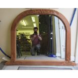 An early 20thC oak overmantel mirror, the wide pine frame carved with oak leaves and acorns  39"h