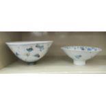 Two Margaret Frith pottery bowls, each of conical, footed form, decorated with geometric flowers  9"