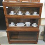 A mid 20thC Globe Wernicke three section, glazed mahogany stacking bookcase, raised on bracket feet