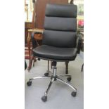 A 2012 Teknik Office Ltd chromium plated steel and black fabric upholstered desk chair, on a