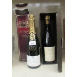 A bottle of 1990 Jacquesson & Fils Champagne; and a bottle of 1989 Roger Brut Champagne  each boxed