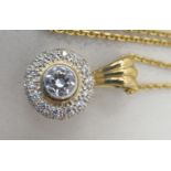 A 9ct gold pendant necklace set with white stones, on a 9ct gold chain